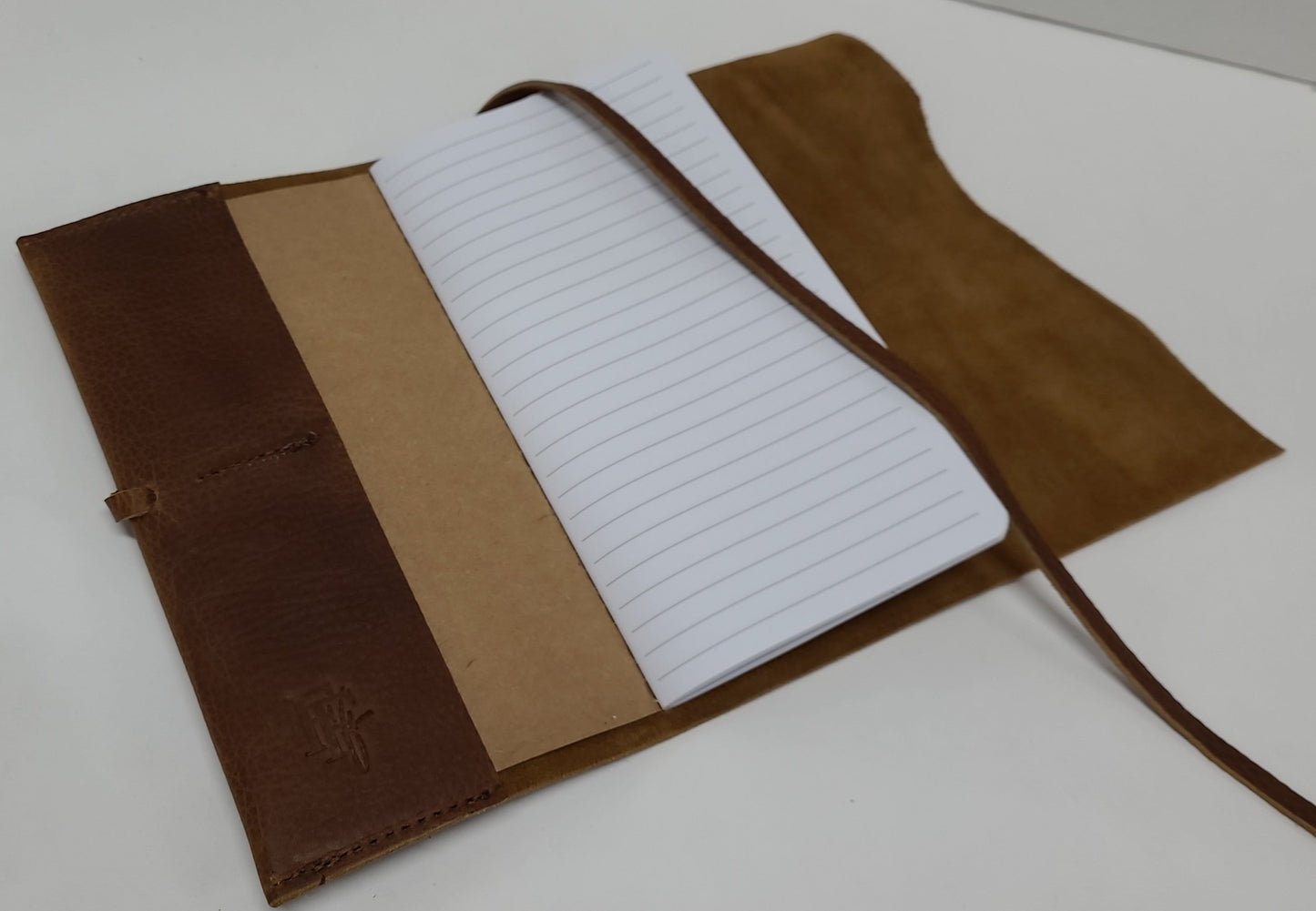 Leather journal inside ruled notebook